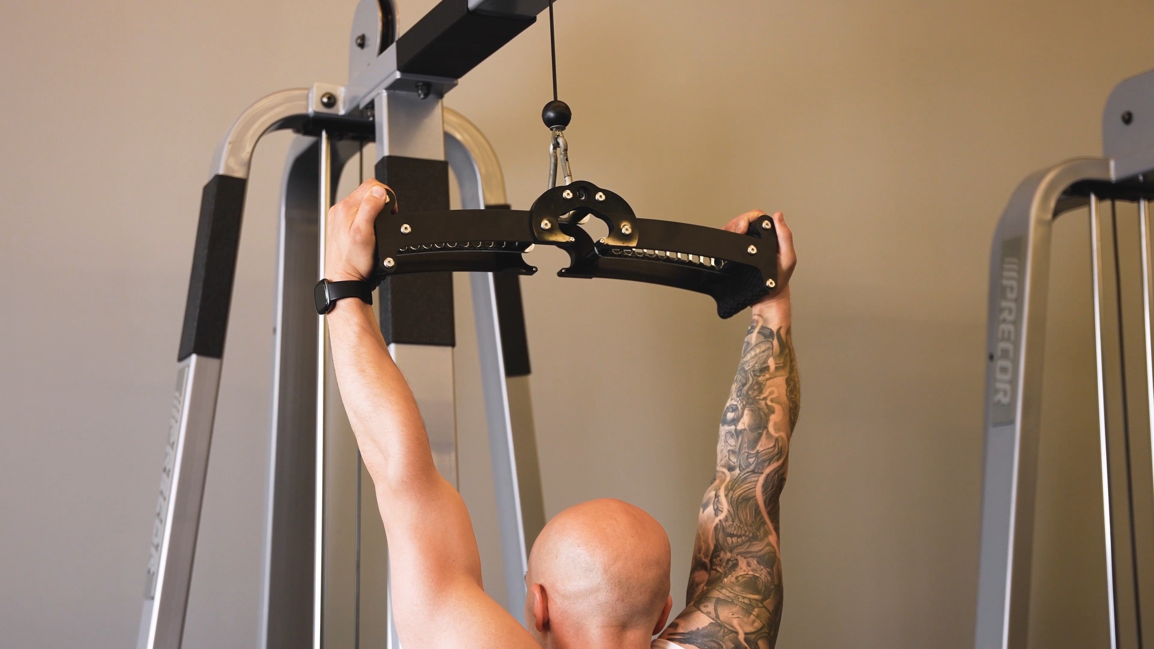 A lifter performing a neutral-grip pulldown with the Back Bar