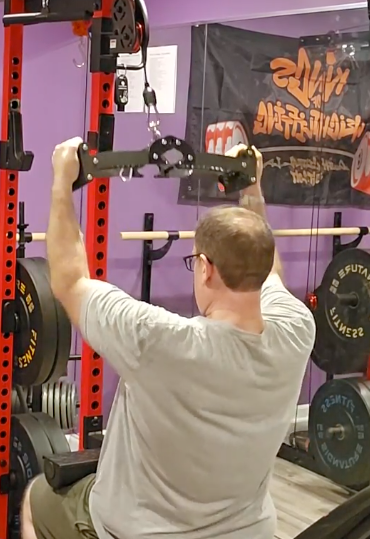 Justin M. using the Back Bar