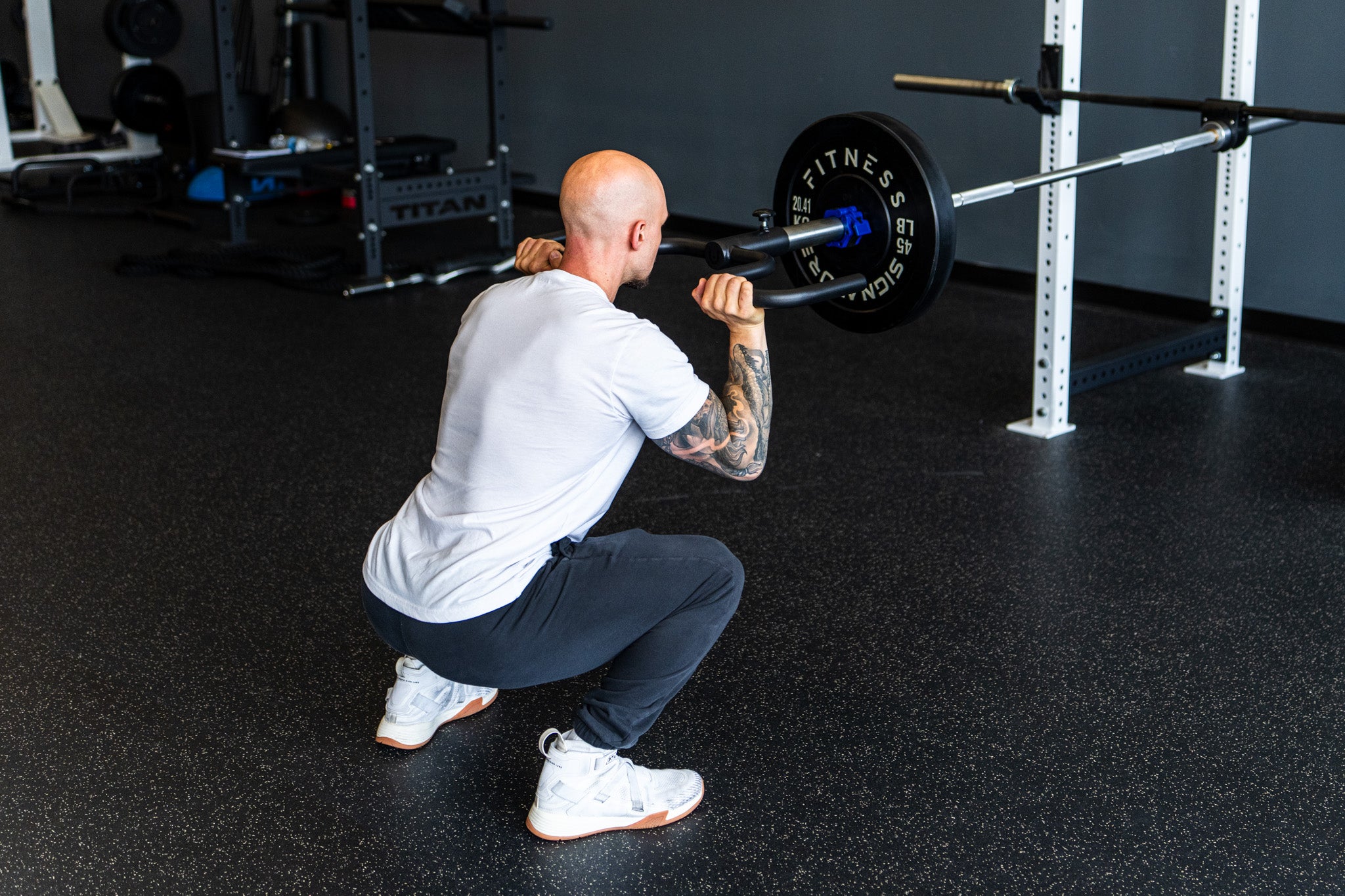A lifter training with the Viking Press in a real gym